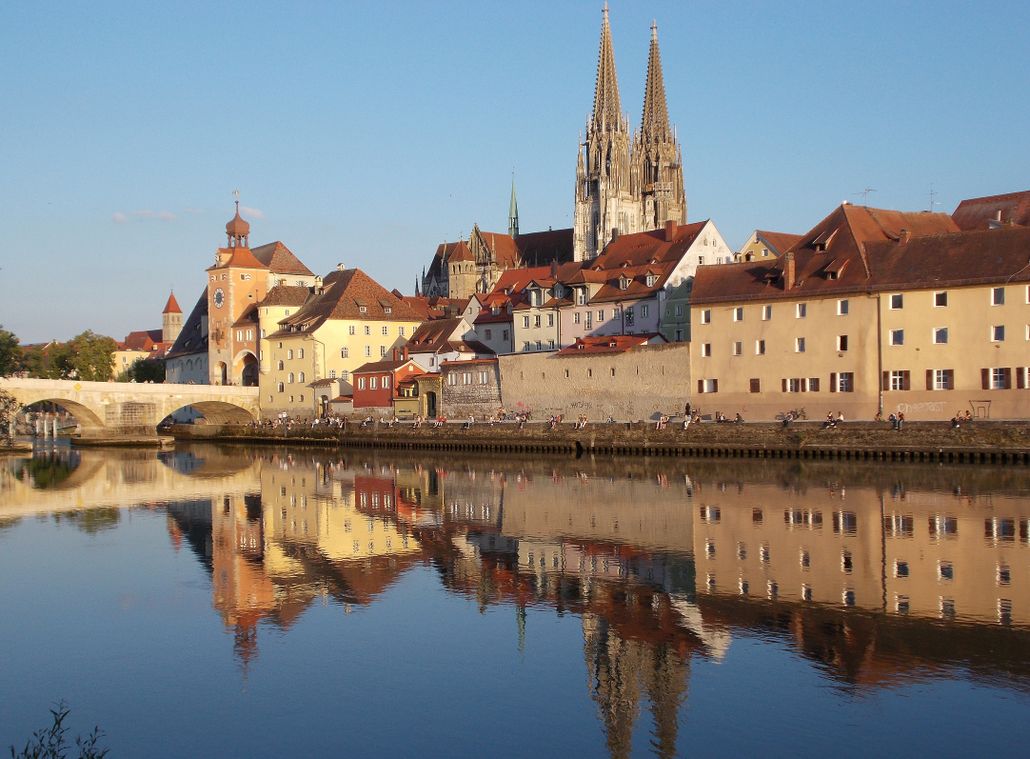 Historic architecture and reflections in Regensburg, Germany by the Danube River.