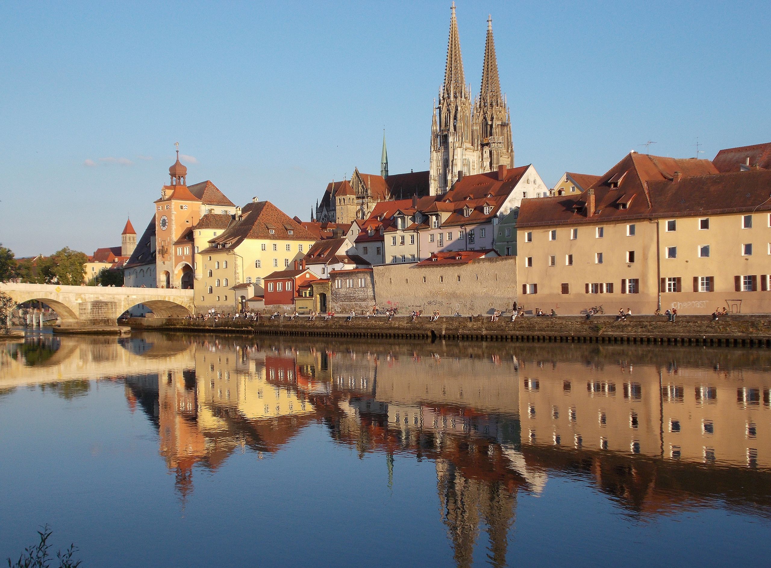 Historic architecture and reflections in Regensburg, Germany by the Danube River.